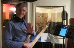 Electric Bassist in Mirror Sound's Iso Booth while recording with a drummer in the other room