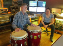 Two Musicians posing for a Photo in Mirror Sound's Control Room