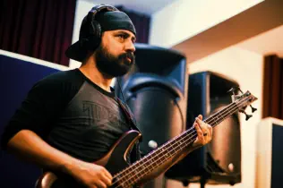 Bassist recording bass in Mirror Sound